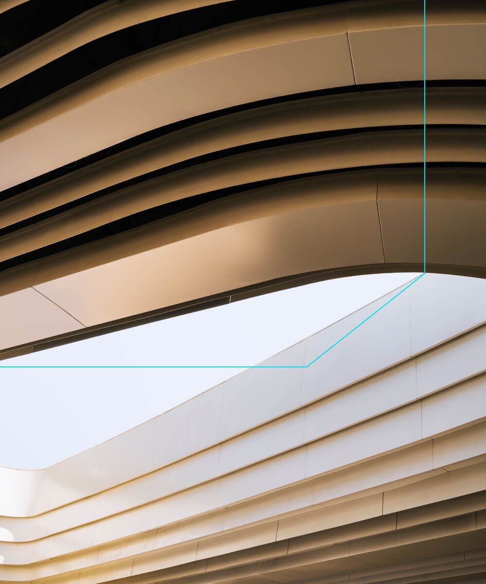 Curved ceiling design with layered metallic panels in natural light – Neutrinos